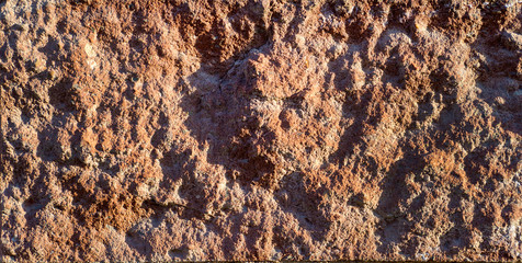 The texture of old rough stone.