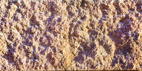 The texture of old rough stone.