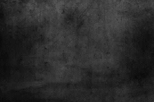 Grunge textured dark concrete wall background