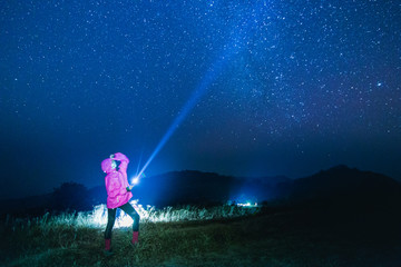 Blue dark  night sky with  star Milky way Space background and silhouette of a standing happy man