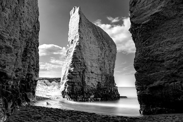 Dreamy tranquility concept with atmospheric monochrome photograph of iconic chalk steep cliff and...