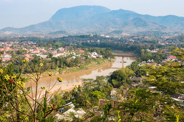 Fototapeta na wymiar View of Luang Prabang town from the top of Mt.Phu Si (or Mt.Phou Si) high hill in the centre of the old town of Luang Prabang in Laos.
