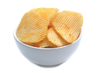 Potato chips on bowl isolated on white