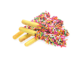 Biscuit stick bread with sweet colorful chocolate isolated on white background