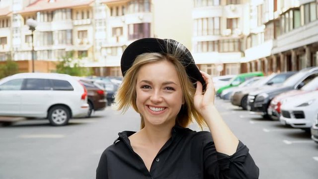 The camera monitors a young attractive girl. Women's walk