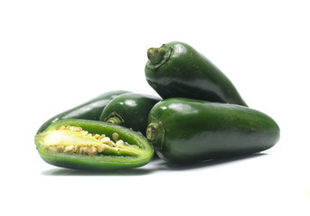 green chilies on white background (jalapeno)