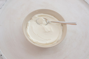 natural greek yogurt in cup on