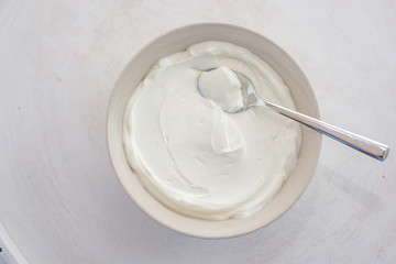 natural greek yogurt in cup on