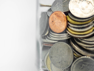 Glass jar Coin Thai,Pile of coins heap of coins silver gold,Stacks on a white background,Investment money concept, Coin stack growing,Isolated
