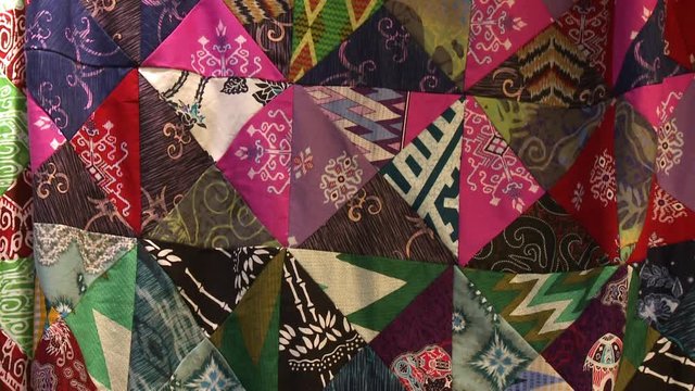 Close-up low-angle tilting shot of a batik fabric with mismatching rectangular paintings and colours, Kuala Lumpur, Malaysia