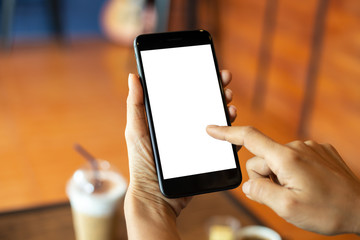 woman hand using smartphone In the coffee shop,Screen blank