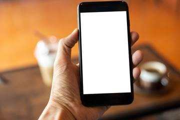 woman hand using smartphone In the coffee shop,Screen blank