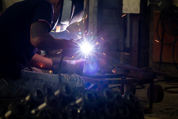 welder works in metal industry