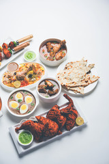 Assorted Indian Non Vegetarian food recipe served in a group. Includes Chicken Curry, Mutton Masala, Anda/egg curry, Butter chicken, biryani, tandoori murg, chicken-tikka and naan/roti for ramadan