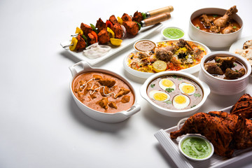 Assorted Indian Non Vegetarian food recipe served in a group. Includes Chicken Curry, Mutton Masala, Anda/egg curry, Butter chicken, biryani, tandoori murg, chicken-tikka and naan/roti for ramadan