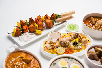 Assorted Indian Non Vegetarian food recipe served in a group. Includes Chicken Curry, Mutton Masala, Anda/egg curry, Butter chicken, biryani, tandoori murg, chicken-tikka and naan/roti