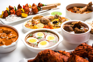 Assorted Indian Non Vegetarian food recipe served in a group. Includes Chicken Curry, Mutton Masala, Anda/egg curry, Butter chicken, biryani, tandoori murg, chicken-tikka and naan/roti