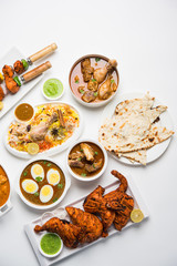 Assorted Indian Non Vegetarian food recipe served in a group. Includes Chicken Curry, Mutton Masala, Anda/egg curry, Butter chicken, biryani, tandoori murg, chicken-tikka and naan/roti