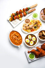 Assorted Indian Non Vegetarian food recipe served in a group. Includes Chicken Curry, Mutton Masala, Anda/egg curry, Butter chicken, biryani, tandoori murg, chicken-tikka and naan/roti