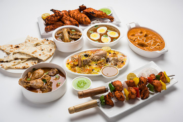 Assorted Indian Non Vegetarian food recipe served in a group. Includes Chicken Curry, Mutton Masala, Anda/egg curry, Butter chicken, biryani, tandoori murg, chicken-tikka and naan/roti