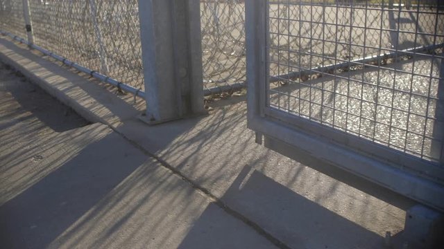 Prison Gate Closing In Slow Motion Razor Wire 4K