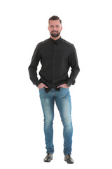 Naklejka premium in full growth. a young man in jeans and a black shirt.