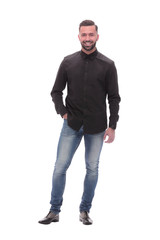 Fototapeta premium in full growth. a young man in jeans and a black shirt.