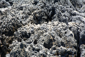 Mediterranean Sea. Coastal cliffs with stone structure with traces of time. Concept - time frozen in stone