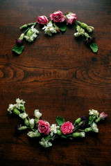 Flowers Composition on a wood table, Greeting card, Rose and carnation composition, Close up shot, Flat lay, top view, copy space.