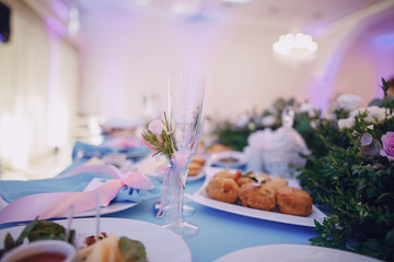 In the restaurant at the wedding table a lot of different meals