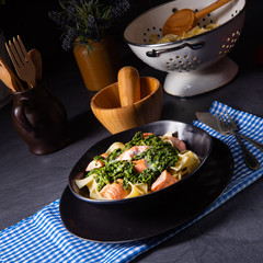 pappardelle pasta with creamed spinach and fried salmon