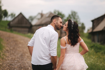 Beautiful wedding couple in Carpathian mountains. Handsome man with attractive woman
