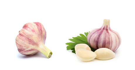 Garlic with leaves of parsley isolated on white