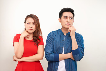 Depressed couple after quarrel on white background
