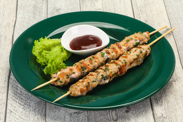 Minced pork skewer kebab with sauce