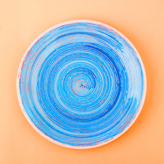 Dark blue plate on the yellow background