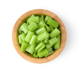 Top view of celery in wood bowl isolated on white background. top view