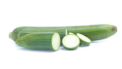 fresh green sponge gourd or luffa with slice isolated on white background
