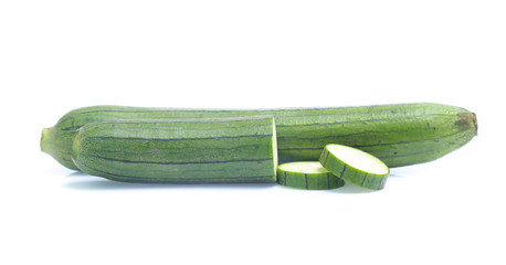 fresh green sponge gourd or luffa with slice isolated on white background