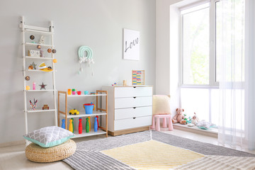 Interior of modern children's room with toys
