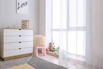 Interior of modern children's room with toys