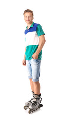 Teenage boy on roller skates against white background