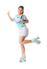 Teenage girl on roller skates against white background