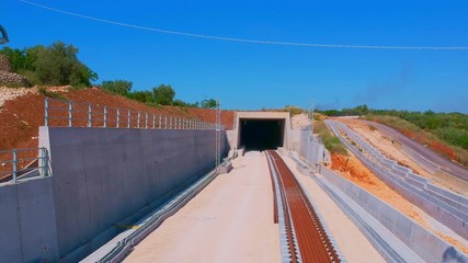 Underpass and tunnel for the construction of a new railway line. Detail of sewage and metal lattice ducts for the electrification of the railway line.