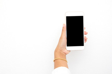 Female hand holding mobile phone isolated on white background, close-up,