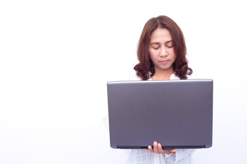 Fototapeta premium Beautiful woman holding a laptop while posing against a white background
