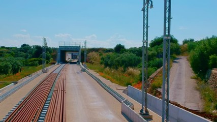 Underpass and tunnel for the construction of a new railway line. Detail of sewage and metal lattice ducts for the electrification of the railway line.