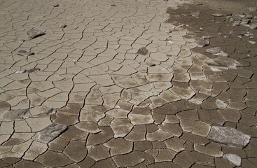 Dry and cracked mud in a lakebed after a severe drought