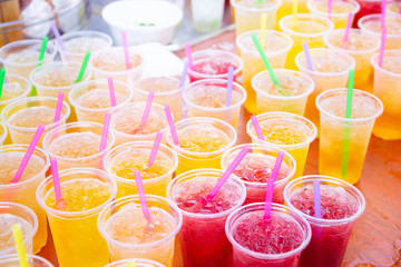 Colorful soft drink in plastic cup