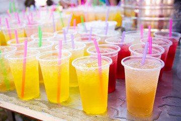 Colorful soft drink in plastic cup